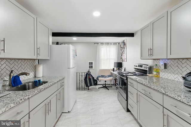 4508 Post Rd, Marcus Hook, PA 19061 - kitchen with stainless steel electric range, a sink, recessed lighting, backsplash, and freestanding refrigerator