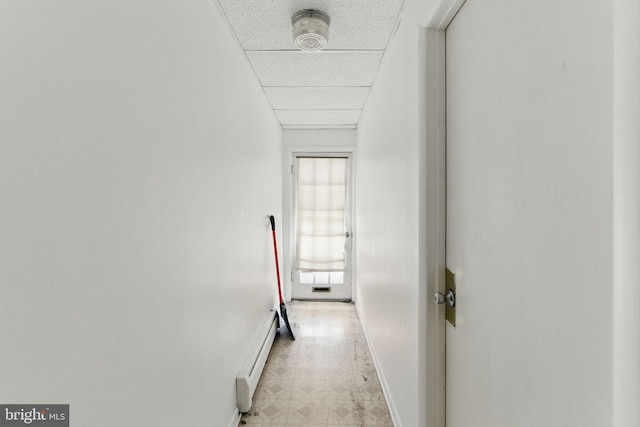 4508 Post Rd, Marcus Hook, PA 19061 - hallway featuring a baseboard heating unit, light floors, and baseboards