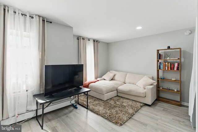 4508 Post Rd, Marcus Hook, PA 19061 - living room with light wood-style floors, baseboard heating, and recessed lighting