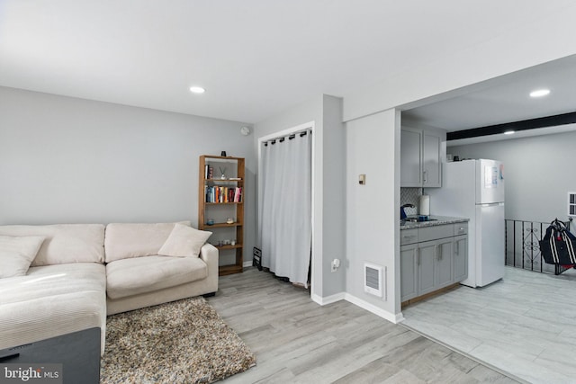 4508 Post Rd, Marcus Hook, PA 19061 - living area with recessed lighting, light wood-type flooring, and baseboards