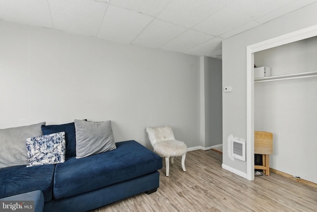 4508 Post Rd, Marcus Hook, PA 19061 - living room featuring wood finished floors, a paneled ceiling, and baseboards