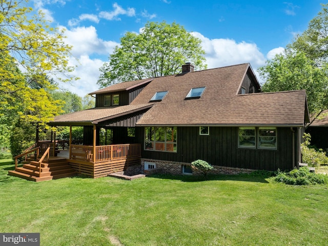 27 Mahala St, Port Matilda, PA 16870 - back of property featuring a shingled roof, a chimney, board and batten siding, a yard, and a wooden deck