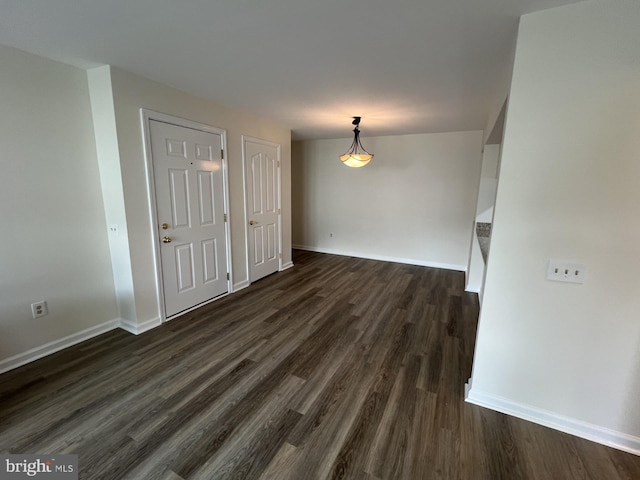 2002 Waters Edge Dr, Newark, DE 19702 - empty room with dark wood-style floors and baseboards