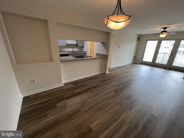 2002 Waters Edge Dr, Newark, DE 19702 - unfurnished living room featuring dark wood-style flooring and ceiling fan