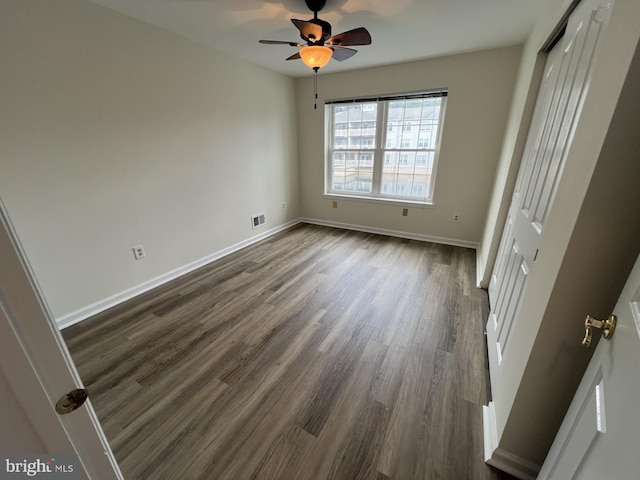 2002 Waters Edge Dr, Newark, DE 19702 - unfurnished bedroom with a closet, dark wood-style flooring, and ceiling fan