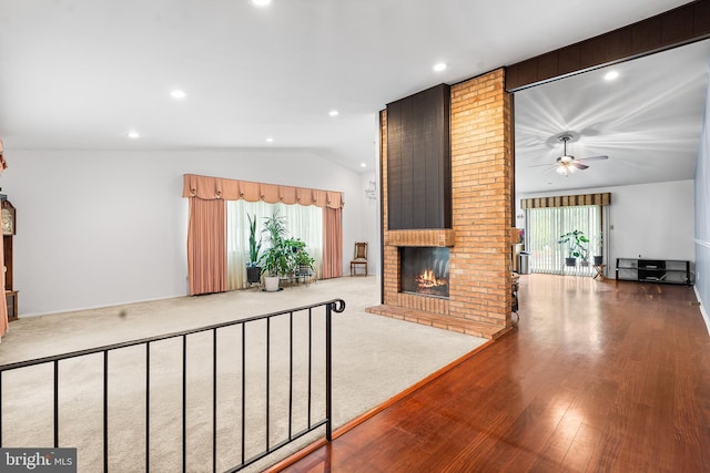 145 Arbor Meadow Dr, Sicklerville, NJ 08081 - unfurnished living room featuring vaulted ceiling, a brick fireplace, a ceiling fan, recessed lighting, and wood finished floors