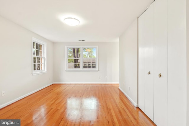10620 Seneca Ridge Dr, Gaithersburg, MD 20886 - unfurnished bedroom featuring light wood-style floors, baseboards, and a closet