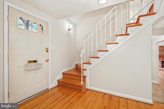 10620 Seneca Ridge Dr, Gaithersburg, MD 20886 - foyer entrance with baseboards, stairs, and wood finished floors