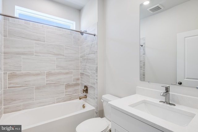 bathroom featuring toilet, shower / tub combination, and vanity