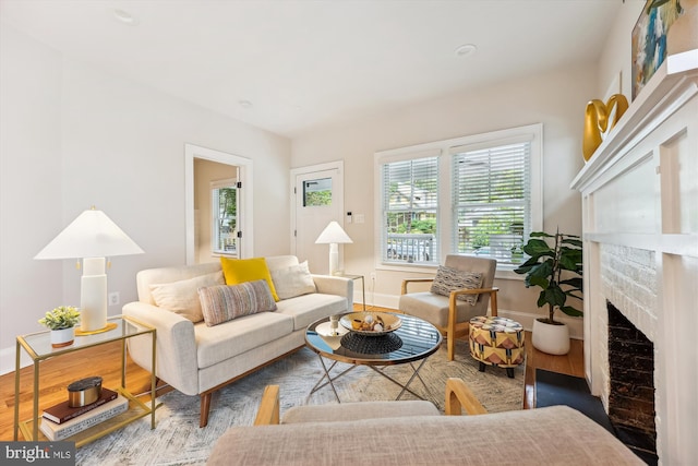 203 Spring Ave, Takoma Park, MD 20912 - living area with wood finished floors, a fireplace, and baseboards