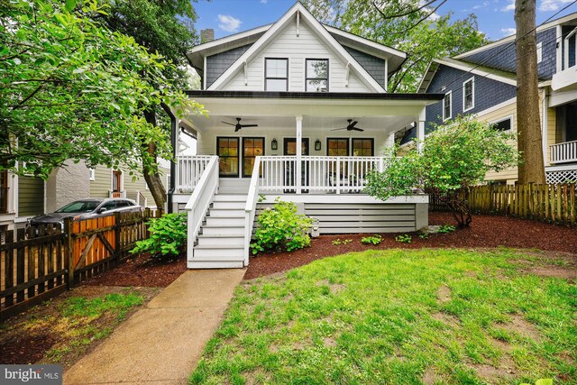 203 Spring Ave, Takoma Park, MD 20912 - view of front of house with ceiling fan, a porch, and stairway