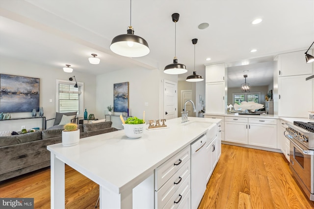 203 Spring Ave, Takoma Park, MD 20912 - kitchen with open floor plan, high end stove, white dishwasher, white cabinetry, and recessed lighting