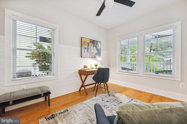 203 Spring Ave, Takoma Park, MD 20912 - home office featuring ceiling fan, wood finished floors, and wooden walls