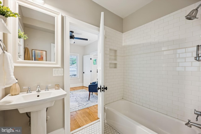 203 Spring Ave, Takoma Park, MD 20912 - full bath with washtub / shower combination, a ceiling fan, and wood finished floors