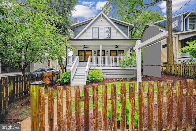 203 Spring Ave, Takoma Park, MD 20912 - view of front of home with a ceiling fan, stairs, covered porch, a fenced backyard, and a chimney