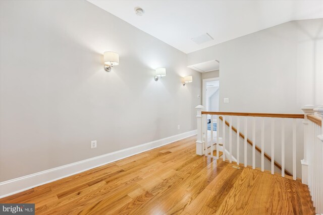 203 Spring Ave, Takoma Park, MD 20912 - spare room featuring wood finished floors, a smoke detector, baseboards, and lofted ceiling