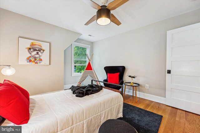 203 Spring Ave, Takoma Park, MD 20912 - bedroom featuring wood finished floors, baseboards, and ceiling fan