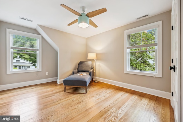203 Spring Ave, Takoma Park, MD 20912 - sitting room with wood finished floors, ceiling fan, and baseboards
