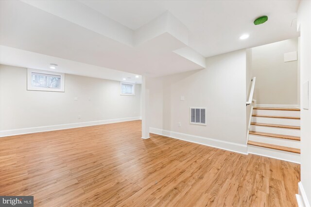 203 Spring Ave, Takoma Park, MD 20912 - below grade area featuring light wood finished floors, stairs, baseboards, recessed lighting, and plenty of natural light