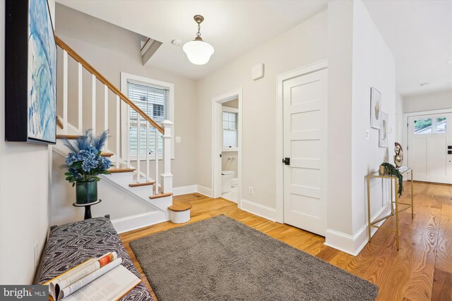 203 Spring Ave, Takoma Park, MD 20912 - entrance foyer featuring healthy amount of natural light, stairs, and wood finished floors