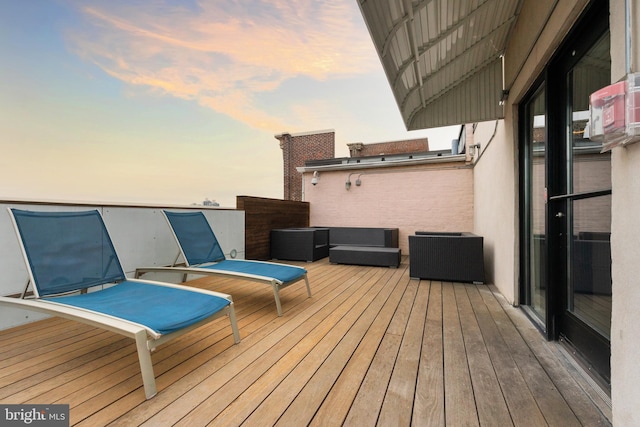 wooden deck with an outdoor living space
