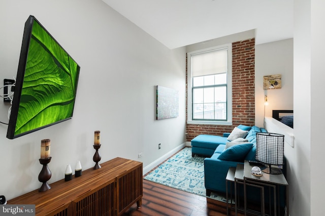 living area with wood finished floors and baseboards