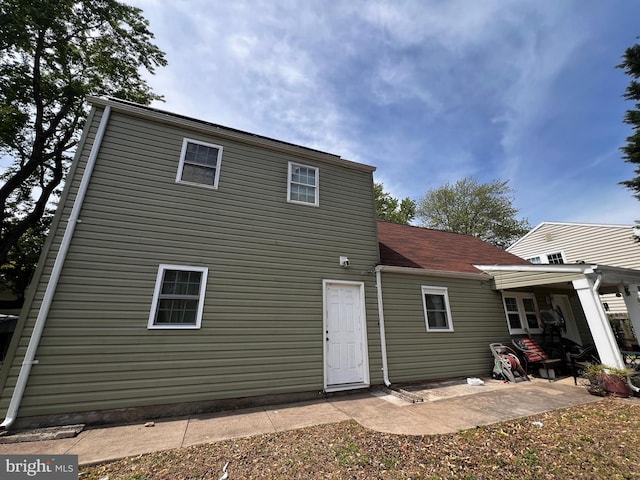 rear view of house featuring a patio