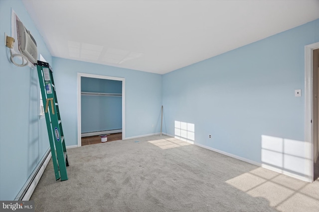 unfurnished bedroom with carpet flooring, a baseboard radiator, and baseboards