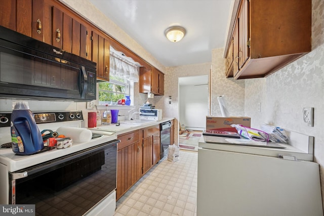 kitchen with black appliances, light floors, brown cabinetry, light countertops, and wallpapered walls