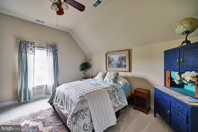 bedroom with light carpet, baseboards, vaulted ceiling, and ceiling fan