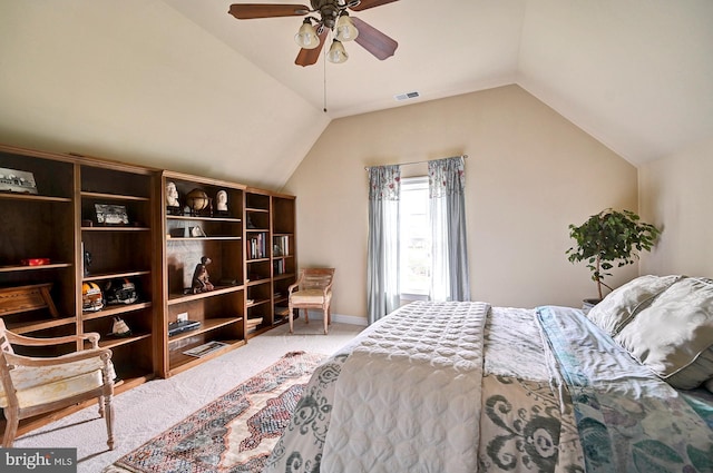 carpeted bedroom with lofted ceiling, baseboards, and a ceiling fan