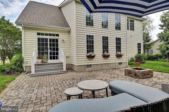 view of patio / terrace featuring an outdoor fire pit
