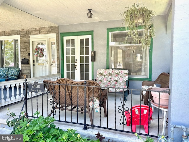 view of patio / terrace featuring covered porch and french doors