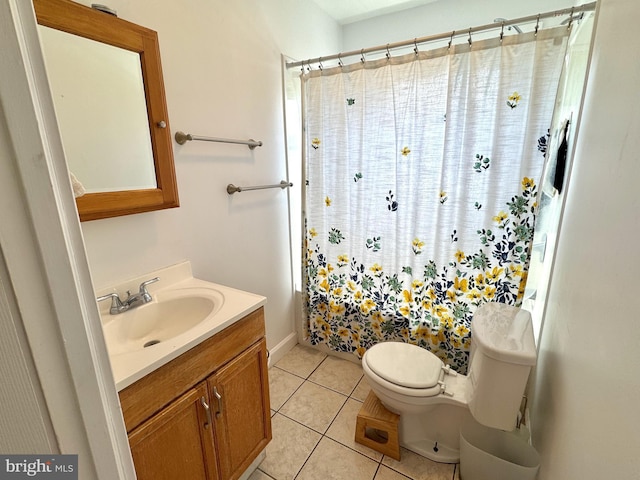 full bathroom featuring toilet, vanity, tile patterned floors, and curtained shower