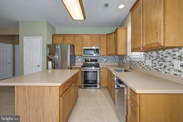 221 Heritage Way, Deptford, NJ 08096 - kitchen featuring stainless steel appliances, a sink, decorative backsplash, and light countertops