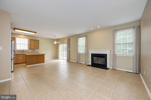 221 Heritage Way, Deptford, NJ 08096 - unfurnished living room with healthy amount of natural light, light tile patterned floors, a fireplace with flush hearth, baseboards, and recessed lighting