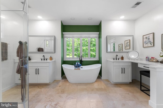 5194 Chase Ln, Midland, VA 22728 - full bathroom with a soaking tub, two vanities, and baseboards