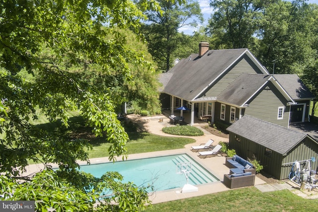 5194 Chase Ln, Midland, VA 22728 - rear view of property featuring a patio area, a chimney, an outbuilding, a yard, and an outdoor pool