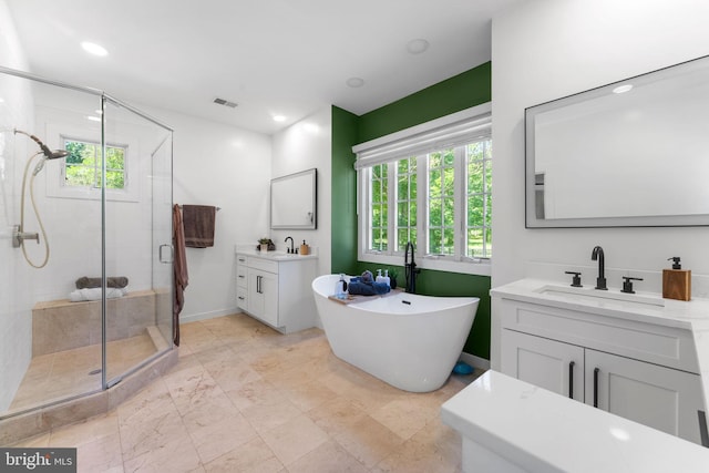 5194 Chase Ln, Midland, VA 22728 - full bathroom with healthy amount of natural light, a shower stall, two vanities, and a soaking tub