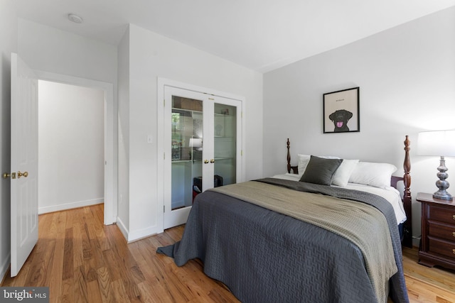 5194 Chase Ln, Midland, VA 22728 - bedroom with french doors, wood finished floors, and baseboards