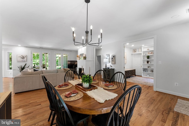 5194 Chase Ln, Midland, VA 22728 - dining area featuring a chandelier, light wood finished floors, baseboards, and french doors