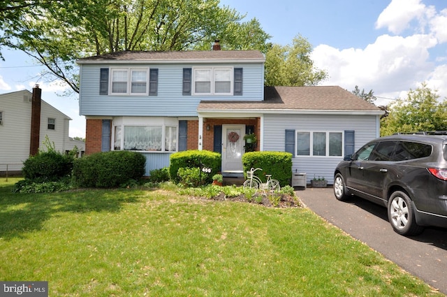 400 S Arthur Dr, Edgewater Park, NJ 08010 - view of front of home featuring a front lawn and brick siding