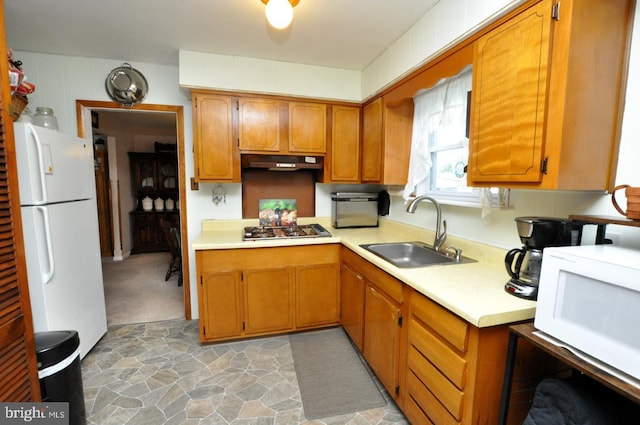400 S Arthur Dr, Edgewater Park, NJ 08010 - kitchen with a sink, white appliances, under cabinet range hood, light countertops, and brown cabinetry