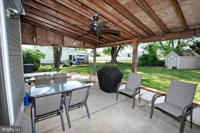400 S Arthur Dr, Edgewater Park, NJ 08010 - view of patio featuring area for grilling, ceiling fan, an outbuilding, a storage shed, and outdoor dining area