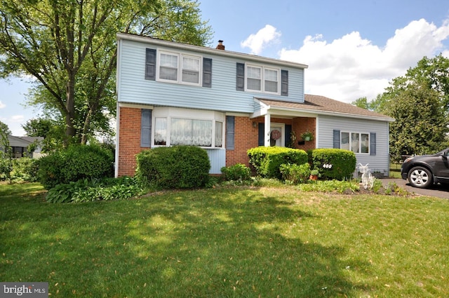 400 S Arthur Dr, Edgewater Park, NJ 08010 - view of front of property with a front yard, brick siding, and a chimney
