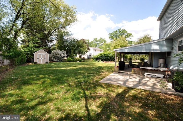 400 S Arthur Dr, Edgewater Park, NJ 08010 - view of green lawn featuring a patio area, a shed, and an outbuilding