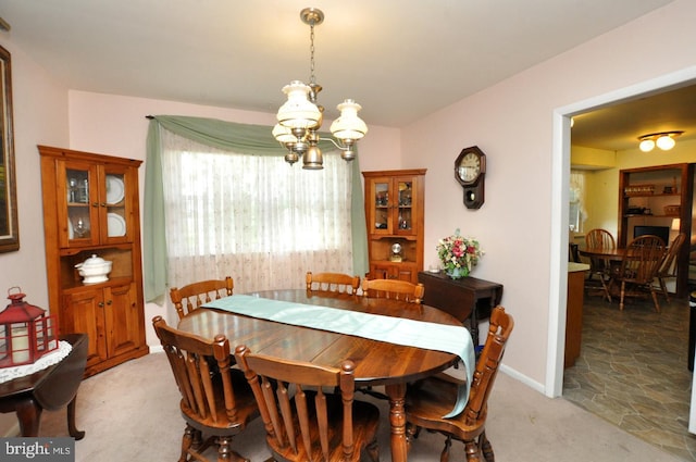 400 S Arthur Dr, Edgewater Park, NJ 08010 - dining room featuring a chandelier, light colored carpet, and baseboards