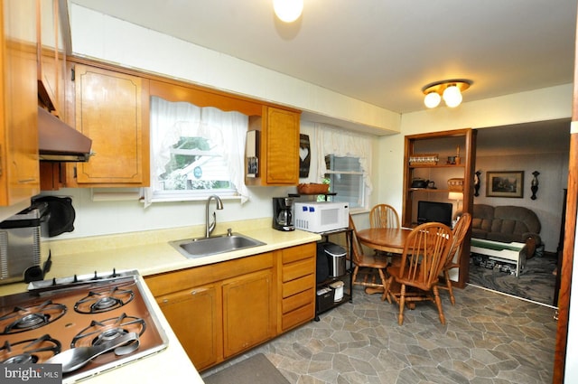 400 S Arthur Dr, Edgewater Park, NJ 08010 - kitchen featuring white microwave, a sink, extractor fan, stainless steel gas stovetop, and light countertops