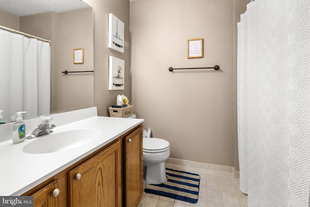 full bathroom with toilet, tile patterned floors, vanity, and baseboards