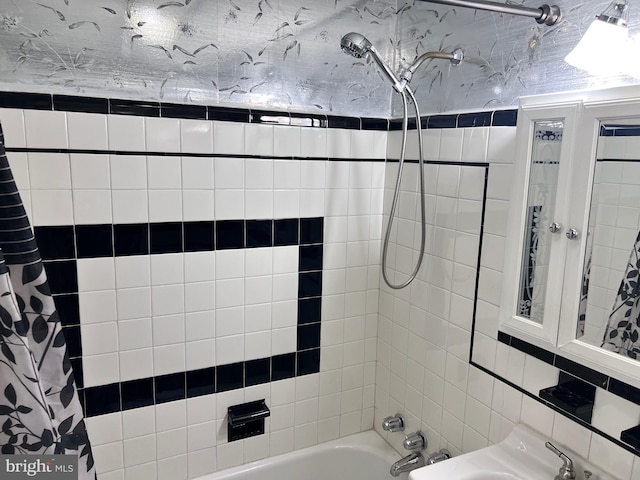 bathroom featuring shower / bath combo with shower curtain